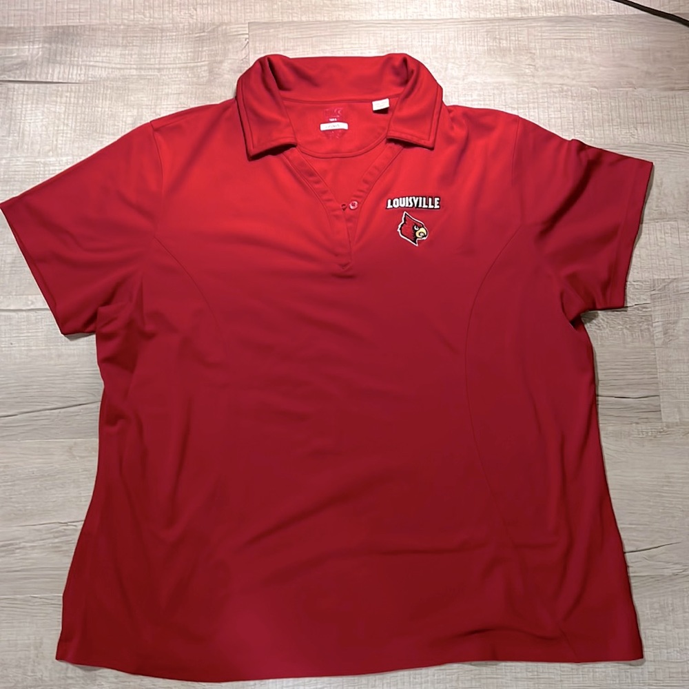 Louisville women’s Cutter & Buck golf short sleeve shirt.